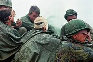 Poncho Prints: Wounded Soldiers Awaiting Evacuation