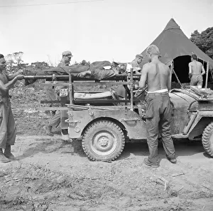 Jeep Prints: Wounded Soldiers Strapped to Litters on Jeep