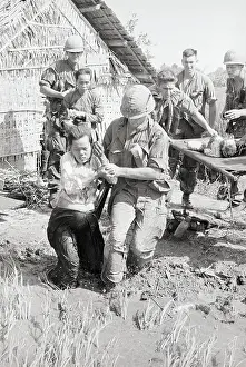 Wounded Vietnamese Evacuated by Soldier