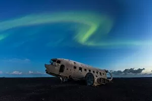 Aurora Borealis Collection: The wrecked plane and northern lights, Iceland