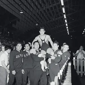 Toledo Prints: Wrestler Carried By Teammates