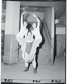 Wrestler Carrying Two Young Women