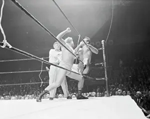 Wrestlers Fighting Against Ropes