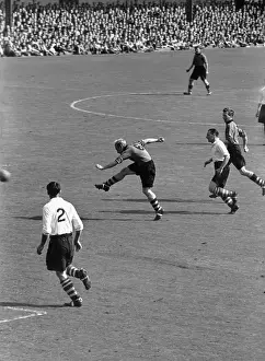 Prints of 24th September 1949: Wolves left half, Billy Wright, makes a sweeping pass as Wolverhampton Wanderers play Middolesbrough A Photographic Legacy: Wright In Action