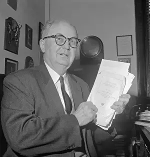 Wright Patman Holding Stack of Documents