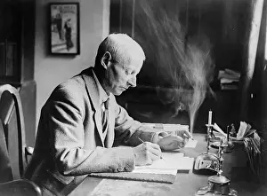 Writer W. W. Jacobs Working at His Desk