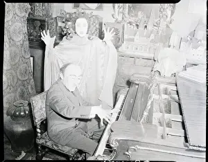 Benda Prints: W.T. Benda Playing Piano to Woman in Mask