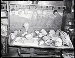 W.T. Benda at Work Painting Mask