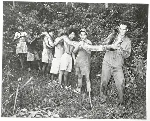 Wyman Carroll and Helpers Holding Long Snake