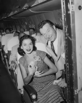 Xavier Cugat and Abbe Lane Aboard Airplane