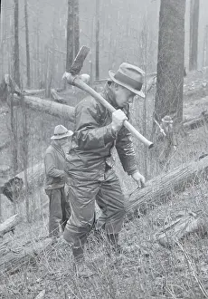 Yacolt Restoration Worker Carrying Hoe in Forest