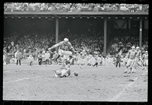 Yale Lary Jumping Over an Opponent