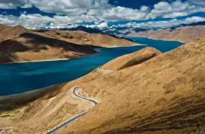 Yamdrok Yamtso Prints: Yamdrok lake with road and sky