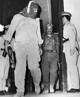Bodyguard Prints: Yasser Arafat Leaves Building with Bodyguard