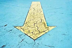 Images Dated 14th September 2012: Yellow arrow on blue asphalt