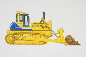 Yellow bulldozer shovelling earth, side view