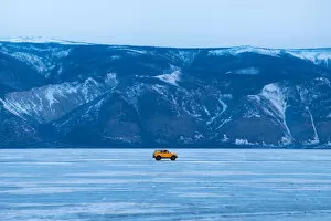 Images Dated 11th March 2016: A yellow car on the frozen Baikal lake
