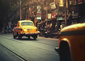 Images Dated 19th January 2017: Yellow taxi cab on the street of Kolkata India