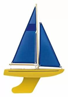 Boat Gallery: Yellow toy sailing boat with blue sail, front view