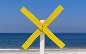 Images Dated 10th June 2014: A yellow wooden cross marks a shoal near the shore at the beach, near Kampen, Sylt