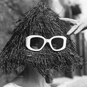 Images Dated 11th March 2016: Yeti Hat; A black spaghetti straw hat, a summer beach fashion from Italy