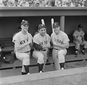 Yogi Berra and Players Posing with Bats