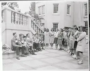 Young Adults Standing or Sitting in Formation for Viewing Purposes
