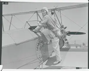 Glendale Prints: Young Aviatrix Climbing into Airplane