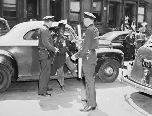 Suspect Prints: Young Black Man in Police Custody