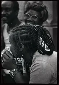 Young Black Woman Leaning over While in Conversation