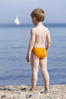 Young boy on the beach, Kuehlungsborn, Mecklenburg-Western Pomerania, Germany, Europe