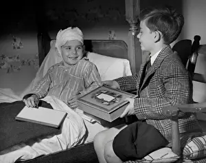 Young boy visiting sick friend