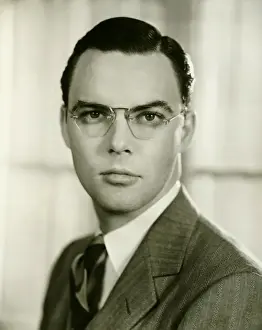 Eyewear Prints: Young businessman in spectacles, (B&W), portrait