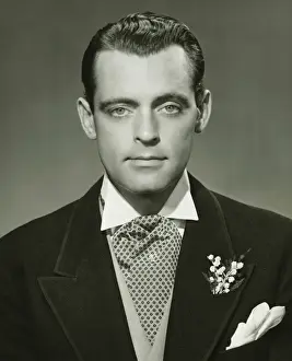Boutonniere Prints: Young businessman in studio, (B&W), portrait