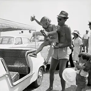 Young Caroline Kennedy Being Carried by Adult Man