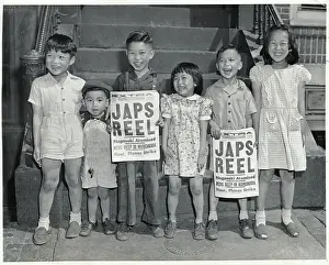 Young Chinese Children Holding Newspapers