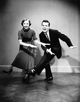 Entertainment Prints: Young couple dancing in empty room, (B&W)