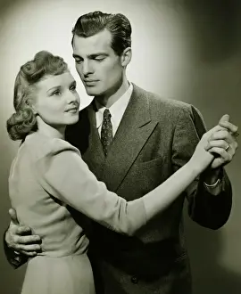 Girlfriend Prints: Young couple dancing in studio, (B&W)