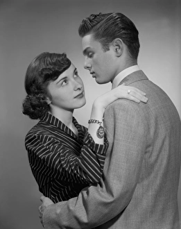 Desire Gallery: Young couple embracing indoors
