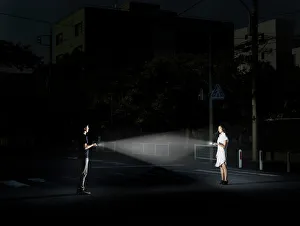 Bizarre Collection: young couple with flashlights