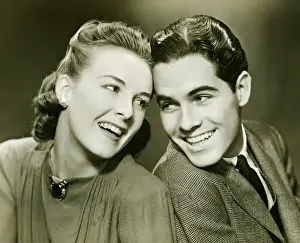 Brooch Prints: Young couple with head to head, smiling, (B&W)