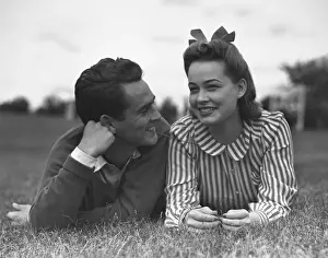 Young couple lying on grass