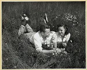 Freckles Prints: Young Couple Lying on Grass