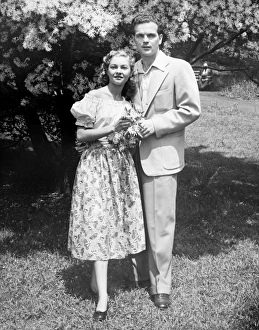 Arm In Arm Gallery: Young couple posing in park, (B&W), (Portrait)