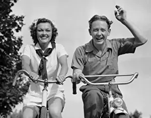 Young couple riding bicycles