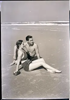 Young Couple Seated on Beach