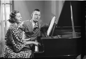 Playful Prints: Young Couple Seated at Piano