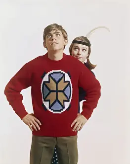 Jumper Prints: Young couple standing against white background