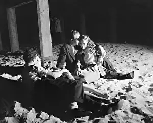 Lovers Prints: Young Couples Snuggle on Beach