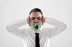 Necktie Prints: Young, desperate man wearing a shirt and a tie holding his hands over his ears
